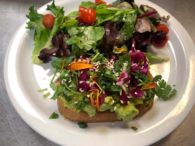 Elevated Avocado Toast with slaw and side salad at Amara, Los Angeles, CA