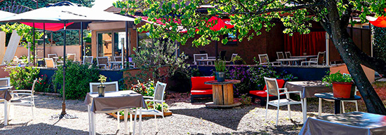 Outdoor seating at Restaurant L'Atelier, l'Art des Mets, Les Tailldes, Luberon, Provence, France